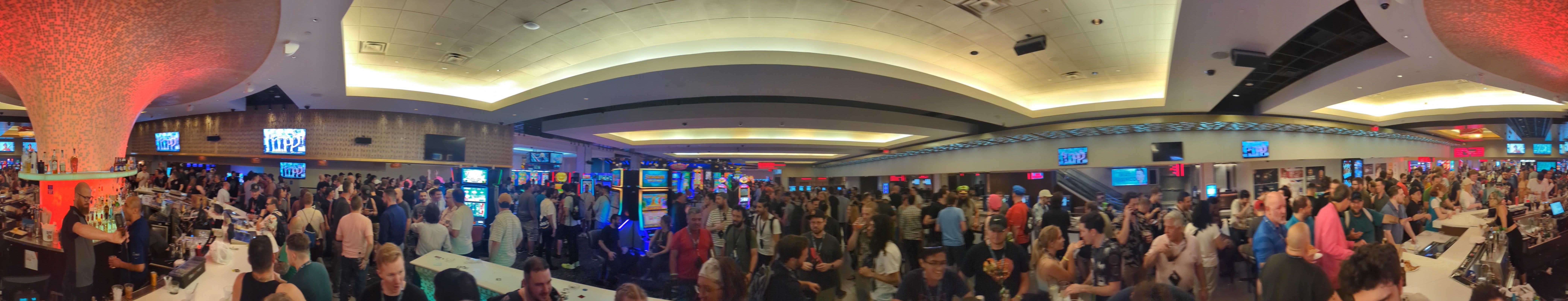 a panoramic of defcon attendees at the linq bar